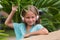 Musical cheerful mood. A little girl listens to music on headphones. Child girl in big headphones enjoys the music