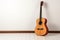 Musical harmony: Acoustic guitar and keys laid flat on a pristine white backdrop.