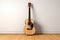 Musical harmony: Acoustic guitar and keys laid flat on a pristine white backdrop.