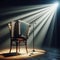 A musical instrument: accordion, sits on alone on stage ready to play, under a strong single spotlight