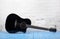 Musical instrument - Black acoustic guitar brick background