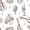 Musical instruments and retro microphone sketches in seamless pattern
