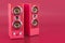 Musical speakers in trending viva magenta colors, 3D rendering