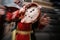 Musical tambourine in the hands of a man dressed in folk