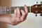 Musician Hand in F Major Chord on Acoustic Guitar