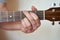 Musician Hand in G Major Chord on Acoustic Guitar