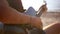 Musician hand playing guitar in the beach during