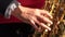 Musician hand playing the saxophone
