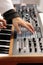 Musician making music with analog synthesizer