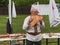 Musician man plying sopilka rebro ethnic woodwind musical instrument. Pan flute music festival Lviv, Ukraine May 14 2022