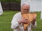 Musician man plying sopilka rebro ethnic woodwind musical instrument. Pan flute music festival Lviv, Ukraine May 14 2022