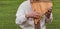 Musician man in vyshyvanka plying sopilka rebro ethnic woodwind musical instrument. Pan flute music festival in Ukraine