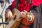 Musician performs a tune on a medieval musical plucked instrument that resembles a mandolin or lute_