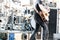musician play acoustic guitar on drum set background. blurred image.