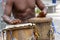 Musician playing atabaque which is a percussion instrument of African origin used in samba, capoeira, umbanda, candomble and other