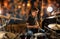 Musician playing drum kit at concert over lights