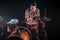 Musician playing drums, black background and beautiful soft light