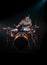 Musician playing drums, black background and beautiful soft light