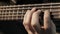 Musician playing five string electric bass guitar