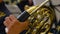 Musician playing the French horn, closeup