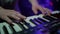 Musician playing on the keyboard synthesizer piano keys. Musician plays a musical instrument on the concert stage