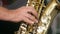 Musician playing saxophone jazz, close up