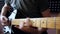 Musician plays on electro guitar in the studio.