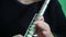 Musician plays the flute. Musician\'s fingers close up.