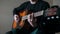 Musician plays the guitar, hands close up