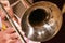 The musician plays a jazz melody on a trombone. Close-up. For music news.