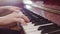 Musician plays notes with hands on the piano, close-up. Artist plays the piano.
