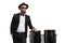 Musician posing next to conga drums