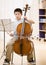 Musician practices performing on cello