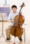 Musician practices performing on cello