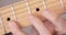 Musician practicing electric guitar, close-up, focus on right hand