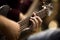 Musician\'s fingers on the strings of a guitar