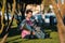 Musician with the tuba sitting on the grass in the Park. Nature.