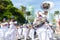 Musicians in a band are playing brass instruments during the pre-carnival Fuzue parade