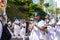 Musicians in a band are playing brass instruments during the pre-carnival Fuzue parade