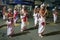 Musicians including Cymbal Players and a horn carrier perform along the streets of Kandy in Sri Lanka during the Esala Perahera.