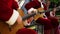 Musicians performing Christmas carol songs to cheer up people before holidays