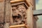 Musicians playing music on pipe, sculpture on column of the15th century Rathaus building