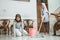 Muslim asian mother and daughter cleaning floor while mopping