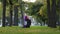 Muslim athletic woman practice yoga sun salutation in park on grass morning routine up facing dog pose asana for body