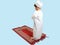 Muslim boy in a dress Praying , isolate background