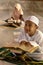 Muslim boy and girls prayer praying together inside the mosque