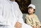 Muslim boy learning how to Salah
