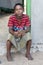 A Muslim boy sits outside a beach shack near Pottuvil on the east coast of Sri Lanka.