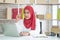 Muslim business woman working in office, Modern Muslim Business Woman, Small business, Online trading and shipping services.