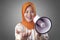 Muslim Businesswoman Calling or Offering Something with Megaphone, Advertising Marketing Concept